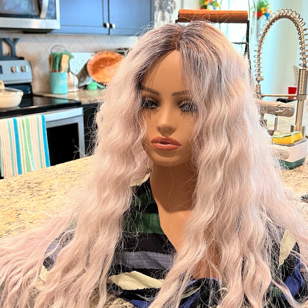 Brand new with tags synthetic wig. Taken out of the box to try on for pictures.
